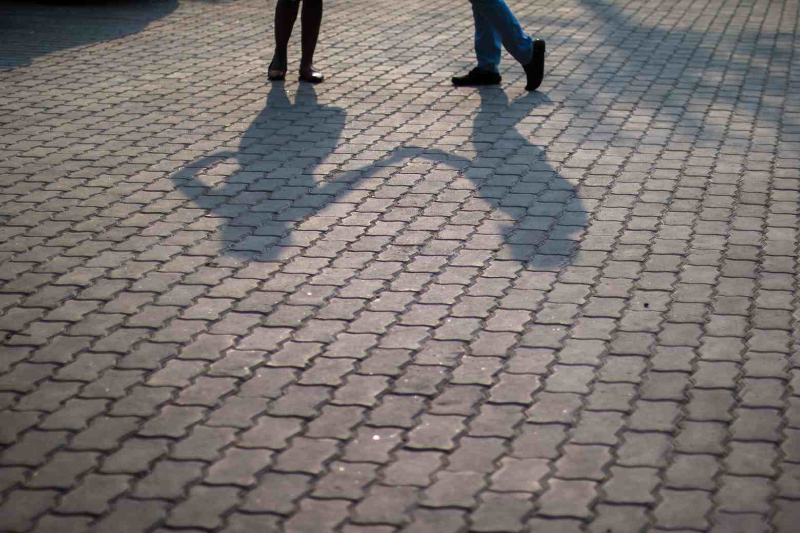 A Couple's Stroll Captured in Light and Shade