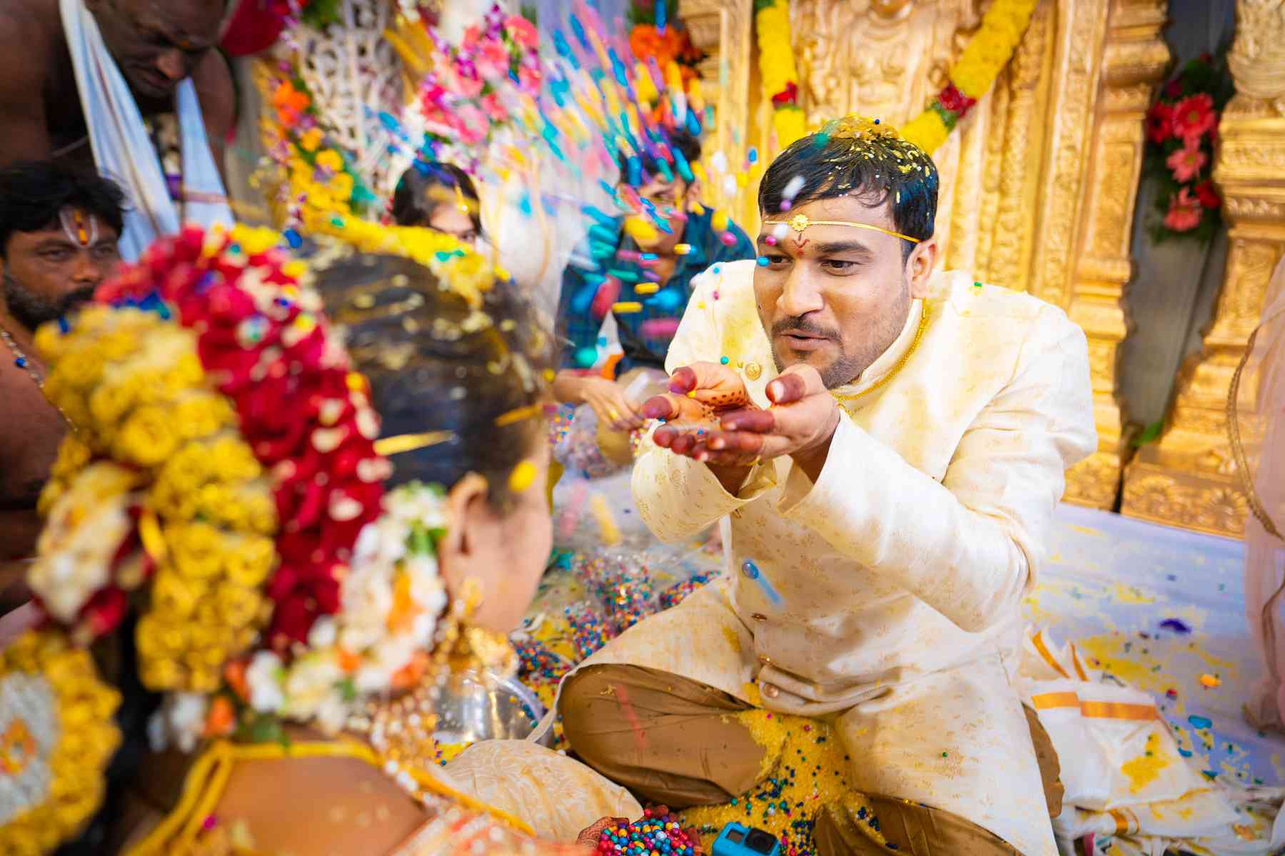 a-shower-of-joy-groom-playfully-tosses-colorful-confetti-at-his-bride