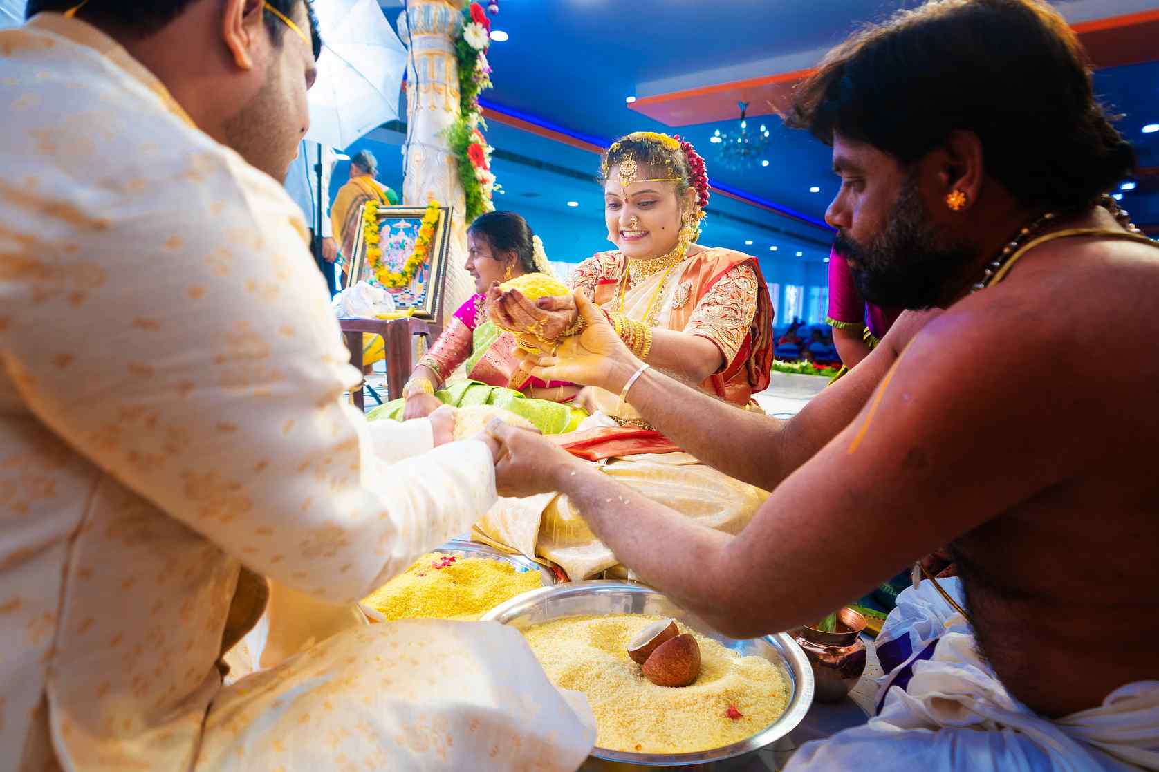 playful-exchange-a-bride-and-groom-during-the-thalambralu-ceremony-at-an-indian-wedding